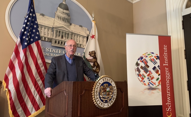 Professor Adam Rose presents his new research.