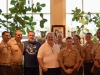 Governor Schwarzenegger and John Milius take a picture with leaders from the United States Marine Corps.